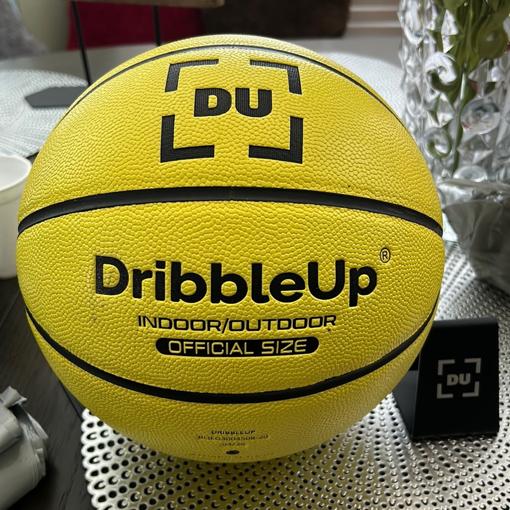 Dribble up official men’s size basketball training ball and phone/tablet stand.